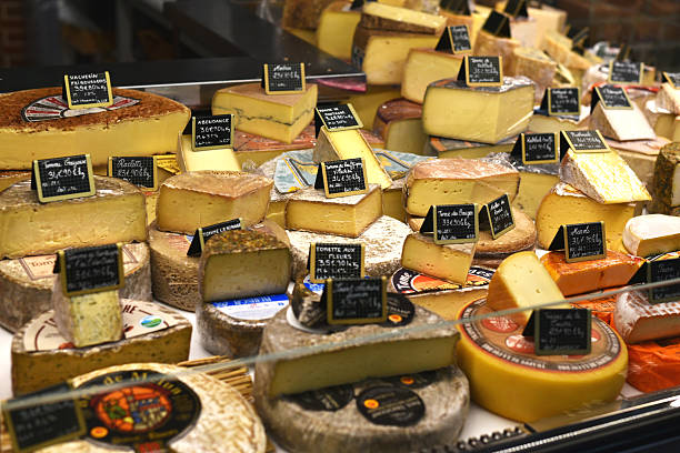 Detail of various types of traditional french cheese on the market in Paris