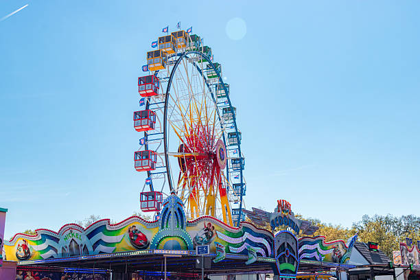 Frankfurt, Germany- April 20, 2025: Ferris wheel attraction spinning at Spring Dippemess annual festival