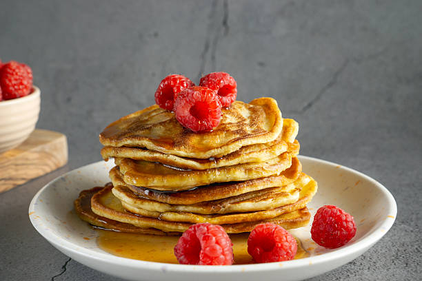 istock banana pancakes with raspberries and syrup 2215760885