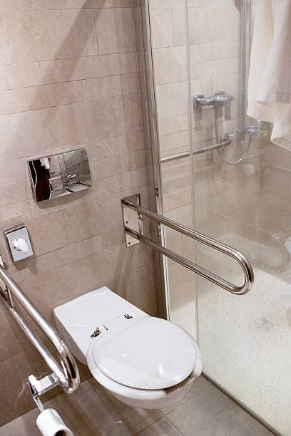 istock Accessible Hotel Bathroom – Toilet with Safety Grab Bars for Disabled and Elderly 2215765310
