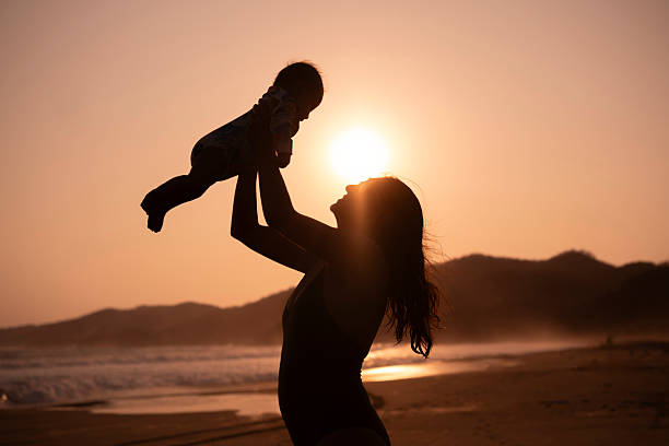 Mother and daughter enjoying the beach