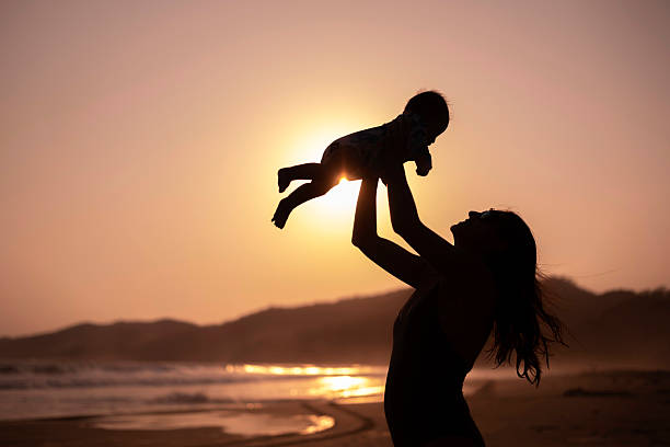 Mother and daughter enjoying the beach