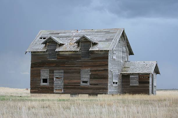 Beautiful old abandoned building farm house in countryside on natural background, photography consisting of old abandoned building farm house at wild grass, old abandoned building farm house over sky