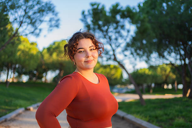 istock Young curvy dancer promoting body positivity in a park 2215772537