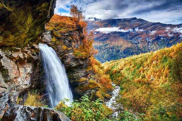 istock Beautifull waterfall in autumn scenery 2215773748