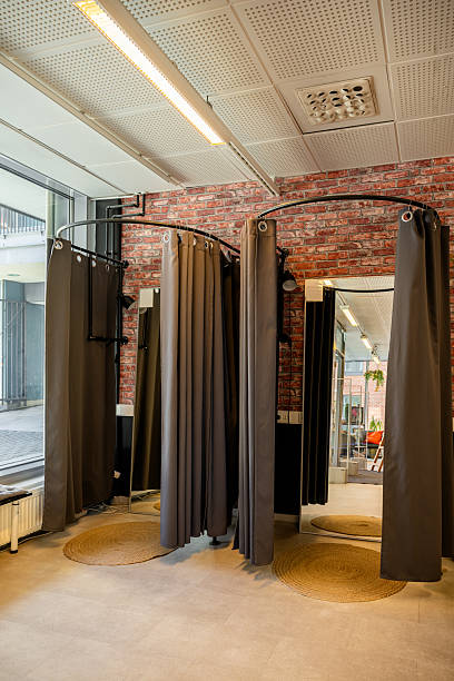istock Modern fitting room with curtains and mirrors in stylish interior space 2215775764