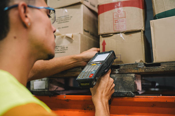 istock Male warehouse worker checking stock with a table 2215775952