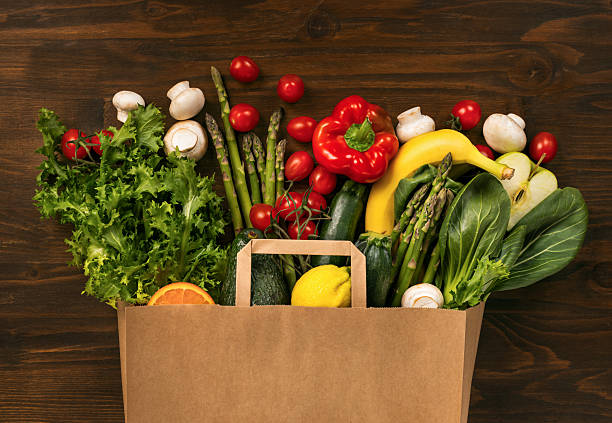 istock Paper bag with fresh vegetables and fruits 2215777623