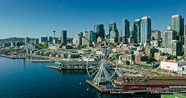 Aerial shot of Downtown Seattle on a sunny day in spring, taken from above Belltown and looking north along the waterfront.Authorization was obtained from the FAA for this operation in restricted airspace.