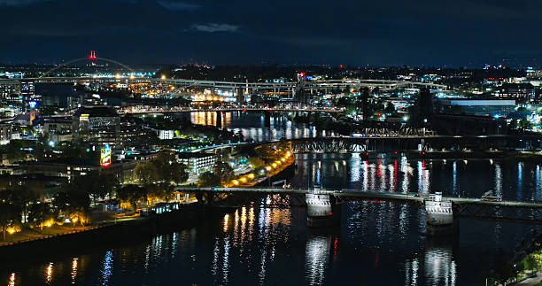 istock City Light Reflections in the Willamette River as it Flows Through Portland - Night 2215783752