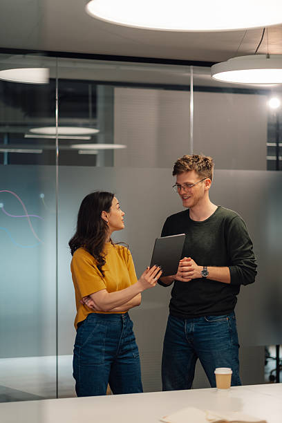 istock Young professionals collaborating on a digital tablet in a modern office 2215785860