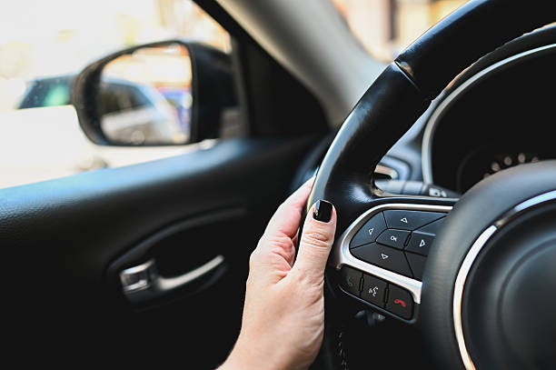 istock Woman driving modern car, holding steering wheel 2215785861