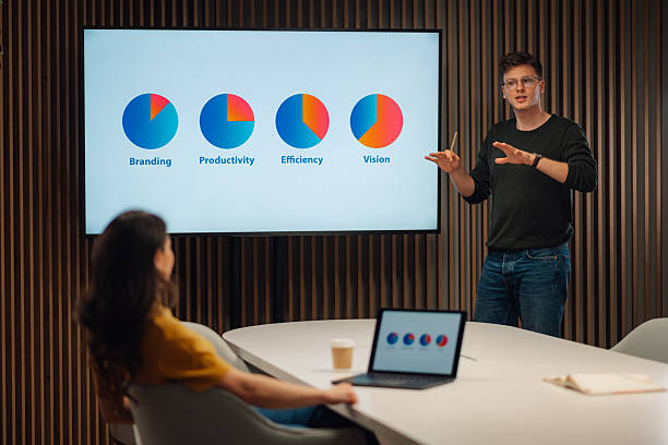 istock Young businessman presenting company strategy during a meeting 2215785872
