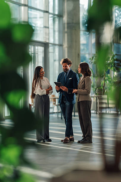 istock Business team discussing strategy on digital tablet in modern office 2215787908