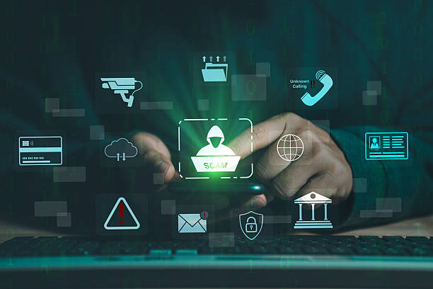 istock Hacker, Scam alert warning with cybersecurity icons. Businessman being deceived the internet to steal personal information. Warning sign with icons representing online threats, phishing, cybersecurity 2215790216