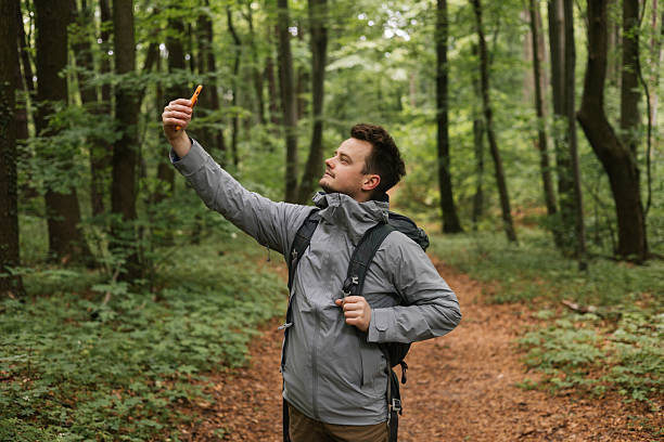 istock Man Taking a Selfie in Nature 2215790327