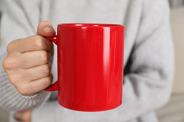 istock Woman with red ceramic cup, closeup. Mockup for design 2215790610