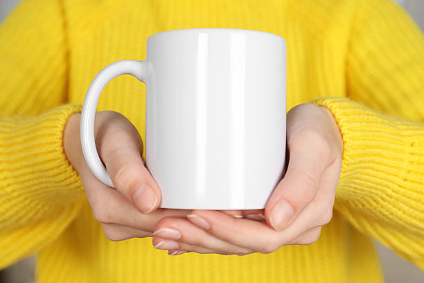 istock Woman with white ceramic cup, closeup. Mockup for design 2215790627