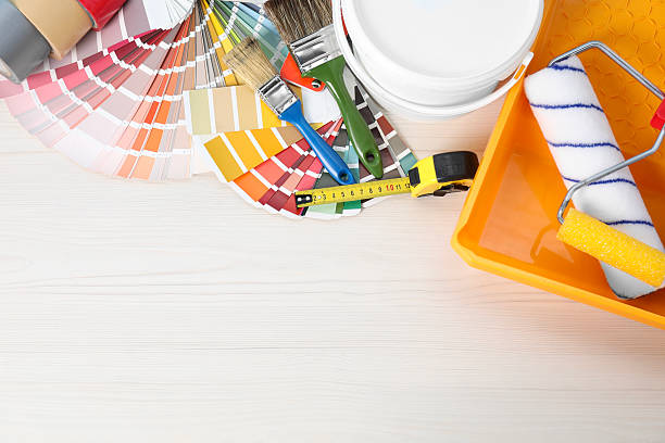 istock Decorating and design. Different painter's tools on white wooden table, flat lay. Space for text 2215790725