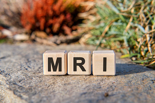 istock MRI - text on cubes standing on a stone on a natural background 2215795166