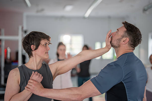istock Women's Self-Defense Training Incorporating Practical Martial Arts Techniques in Action 2215798436