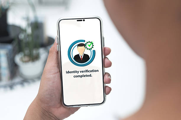 istock Identity verification completed. Customers use smartphones to verify identities through online applications for financial transactions 2215814025