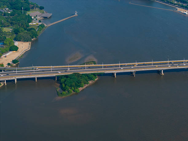 istock Aerial View of a Long Bridge Spanning a River 2215815553