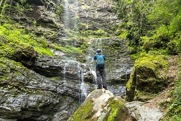 istock Man hiking at waterfalls and streams 2215816018