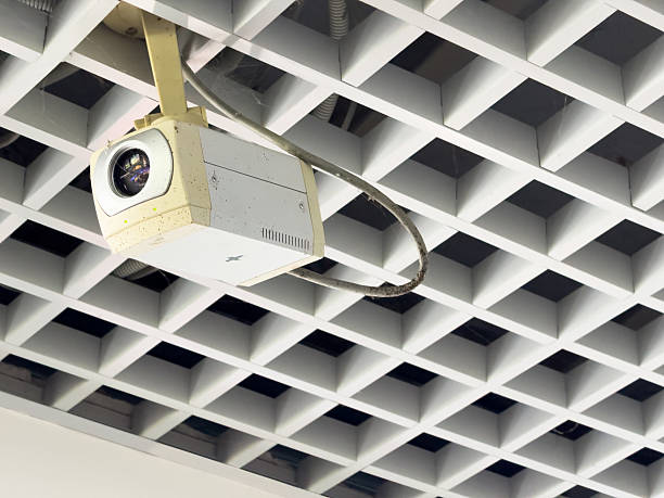 istock A security camera on the ceiling follows every step of a person 2215819896