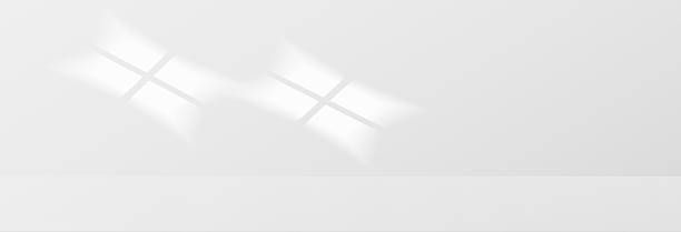 istock Sunlight on light wall, gentle shadow from windows on gray wall. Minimal light gray background for product presentation, vector graphics. Sunny daylight background. 2215820120