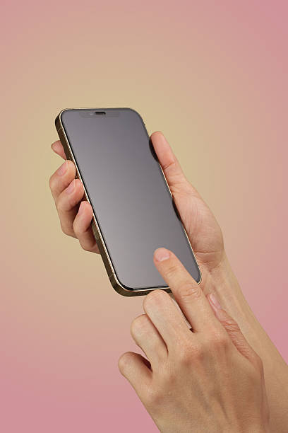 istock female hand holding and clicking , typing on smartphone display 2215822981