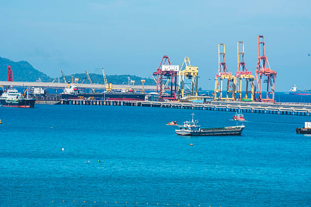 istock Logistic shipping quay boat Engineering crane depot at logistic export terminal control. Warehouse freight background container yard loading quayside harbor port. Logistics seascape shipping portal 2215823191