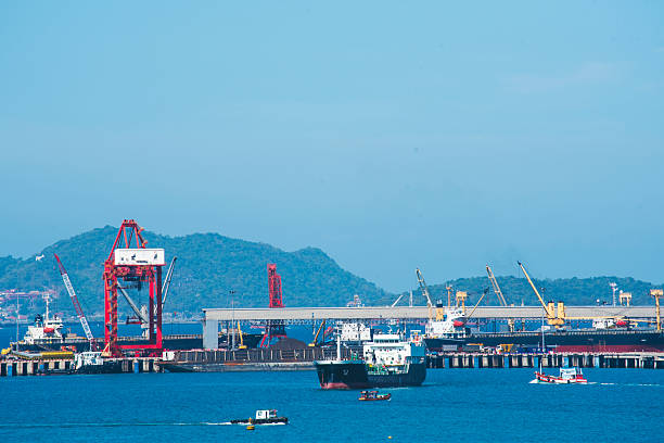 istock Logistic shipping quay boat Engineering crane depot at logistic export terminal control. Warehouse freight background container yard loading quayside harbor port. Logistics seascape shipping portal 2215823208
