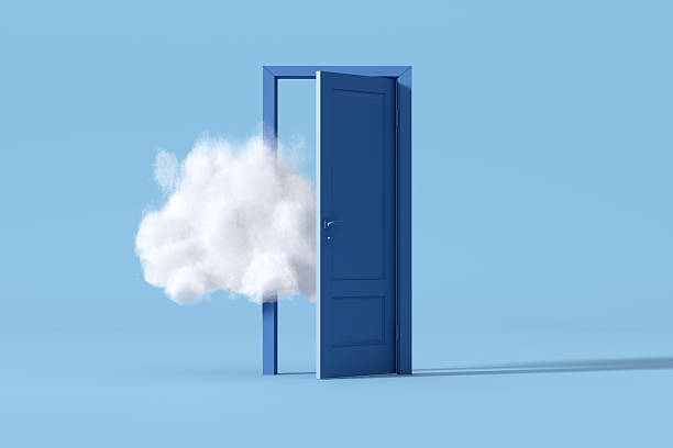 istock Blue door opening to white cloud on light blue background 2215823595