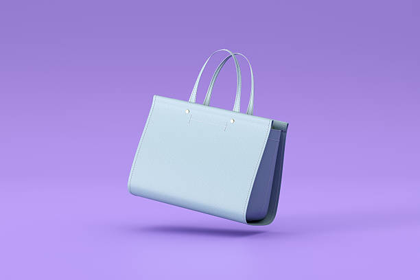 istock Light blue shopping bag floating on a purple background 2215823995