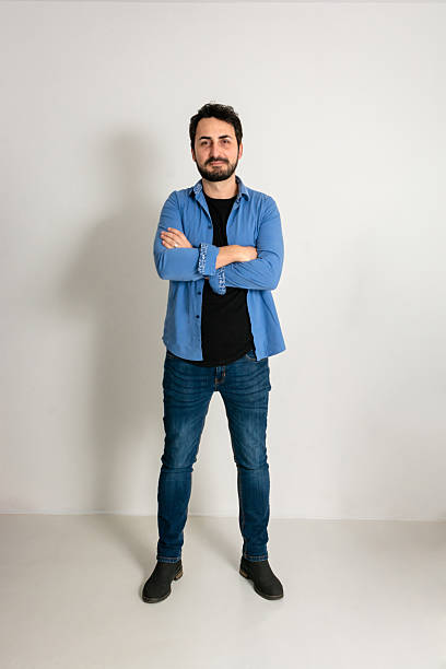 istock Full length of a happy man standing in the studio 2215825476