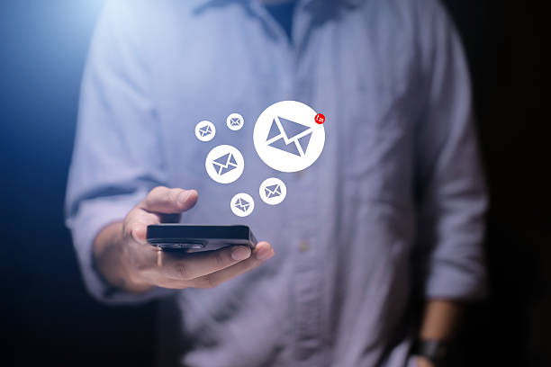 istock Email marketing concept. Hand of businessman using smartphone , tablet, for email virtual screen. Business digital technology and marketing. 2215826211