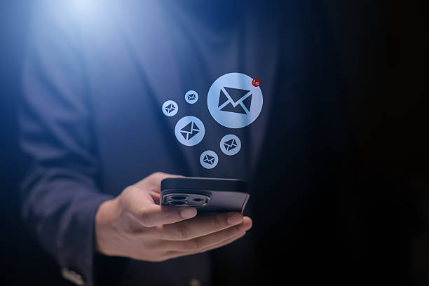 istock Email marketing concept. Hand of businessman using smartphone , tablet, for email virtual screen. Business digital technology and marketing. 2215826217