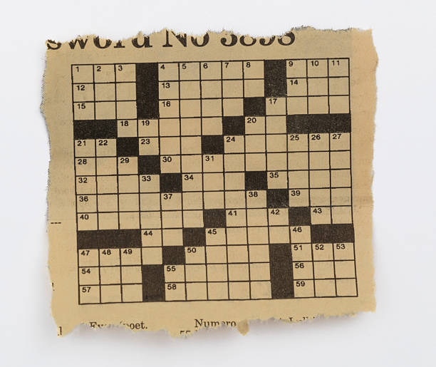 istock A piece of newspaper crossword puzzle on white background 2215827241
