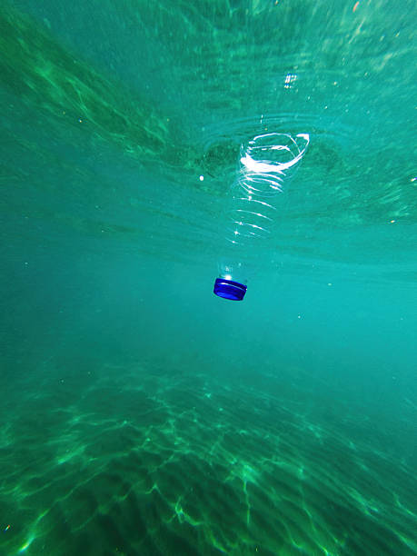 istock Discarded plastic water bottle in the ocean 2215827848