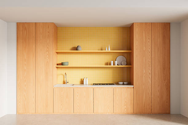istock Modern minimalistic kitchen interior with wooden cabinets, yellow tiled backsplash, open shelving and neutral decor items on light background. 3D Rendering 2215827937