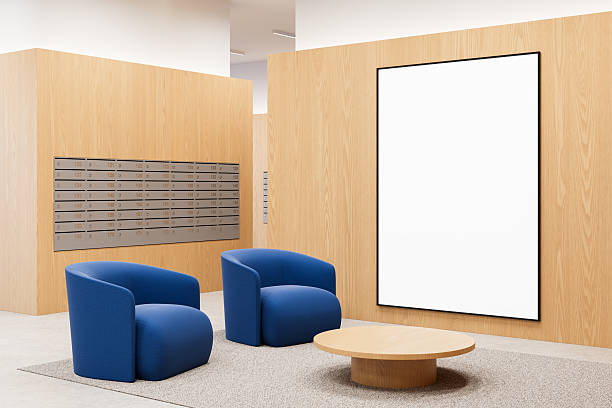 istock Modern interior with blank vertical poster on wood wall, two blue chairs, and round table in clean layout for design or product mockup display scene. 3D Rendering 2215828321