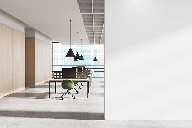 istock Modern open office interior with blank white wall for poster mockup or advertising template display in clean bright workspace layout concept. 3D Rendering 2215828539