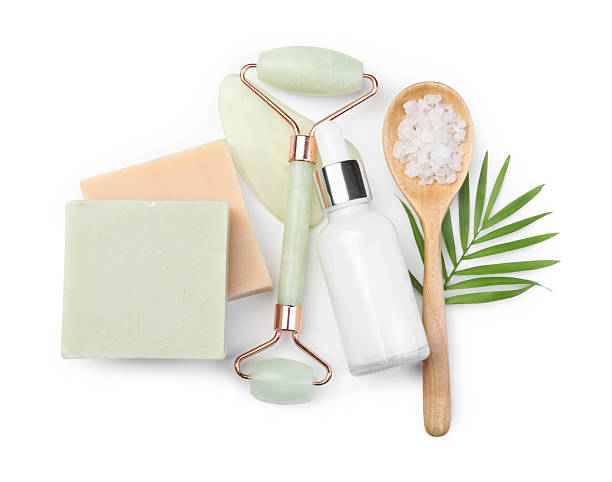 istock Face roller, soap bars and sea salt isolated on white, top view 2215828628