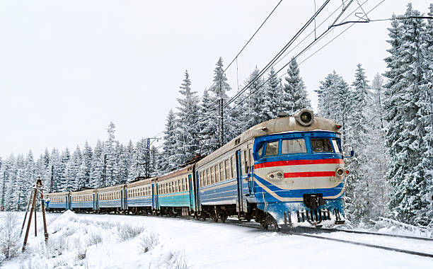 istock Passenger train with snow-covered pines in the Carpathian Mountains, Ukraine 2215829749