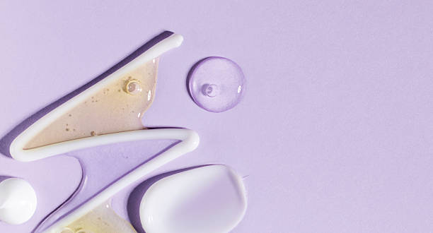 istock cosmetic smears cream texture on pastel purple background 2215830233