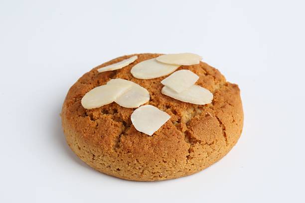istock One tasty cookie with almond flakes on white background 2215830644
