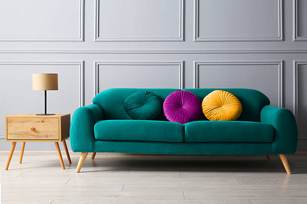 White sofa with cushions in a cozy living room, creating a relaxing and inviting atmosphere