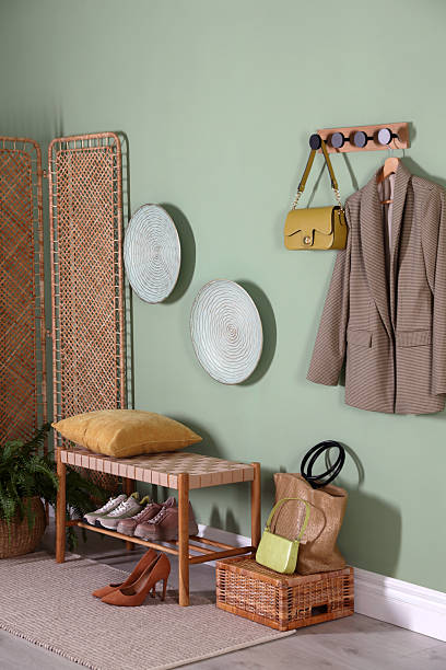 istock Stylish hallway interior with bench and folding screen 2215831400