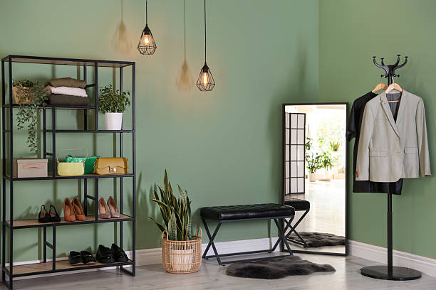 istock Stylish hallway interior with mirror and shelving unit 2215831410